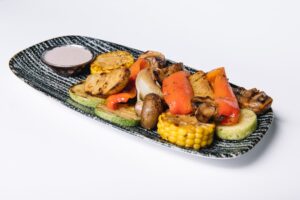 Grilled vegetables on a cutting board | Bar-B-Clean